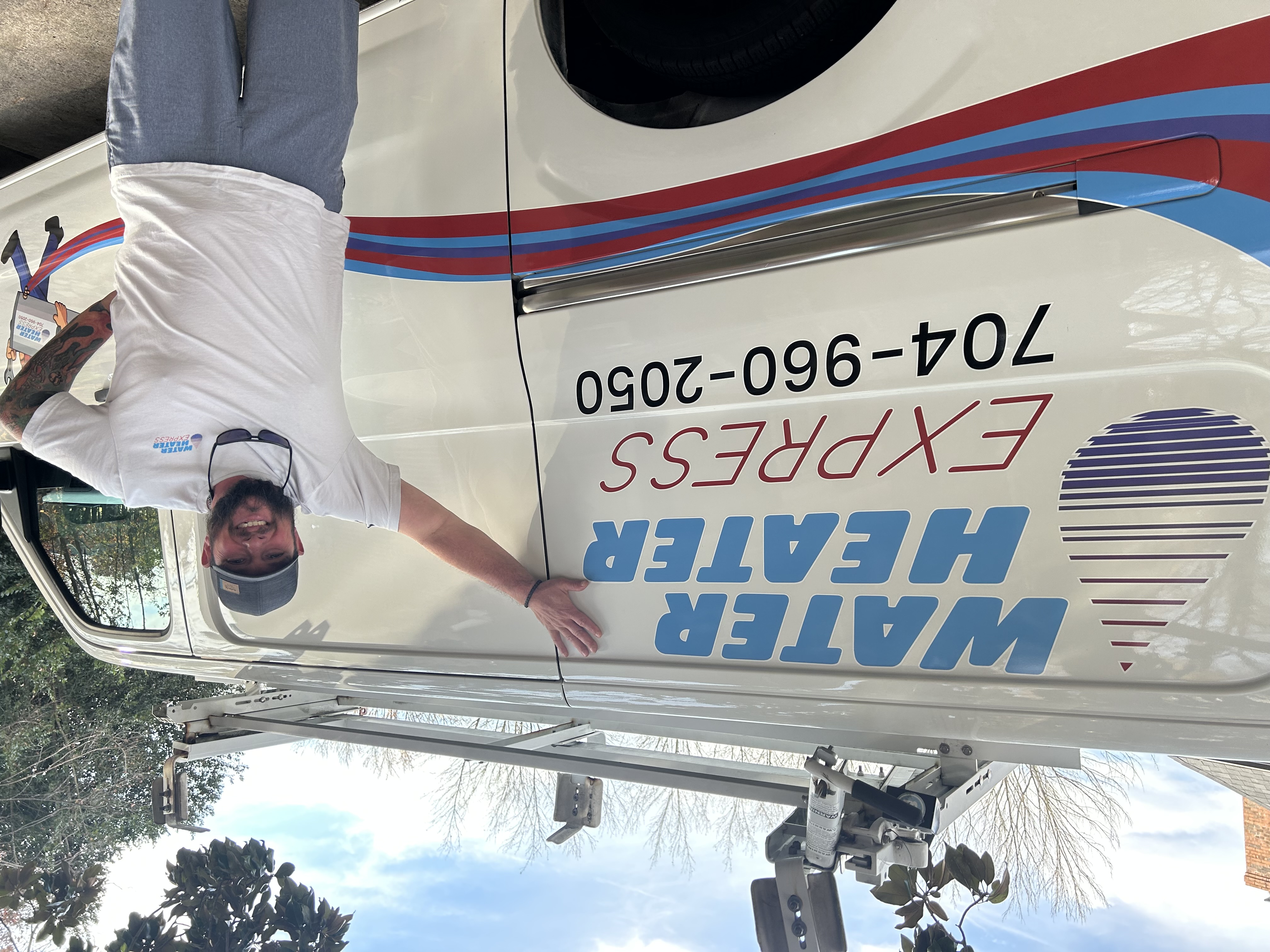 Water Heater Express technician with service van in Charlotte NC