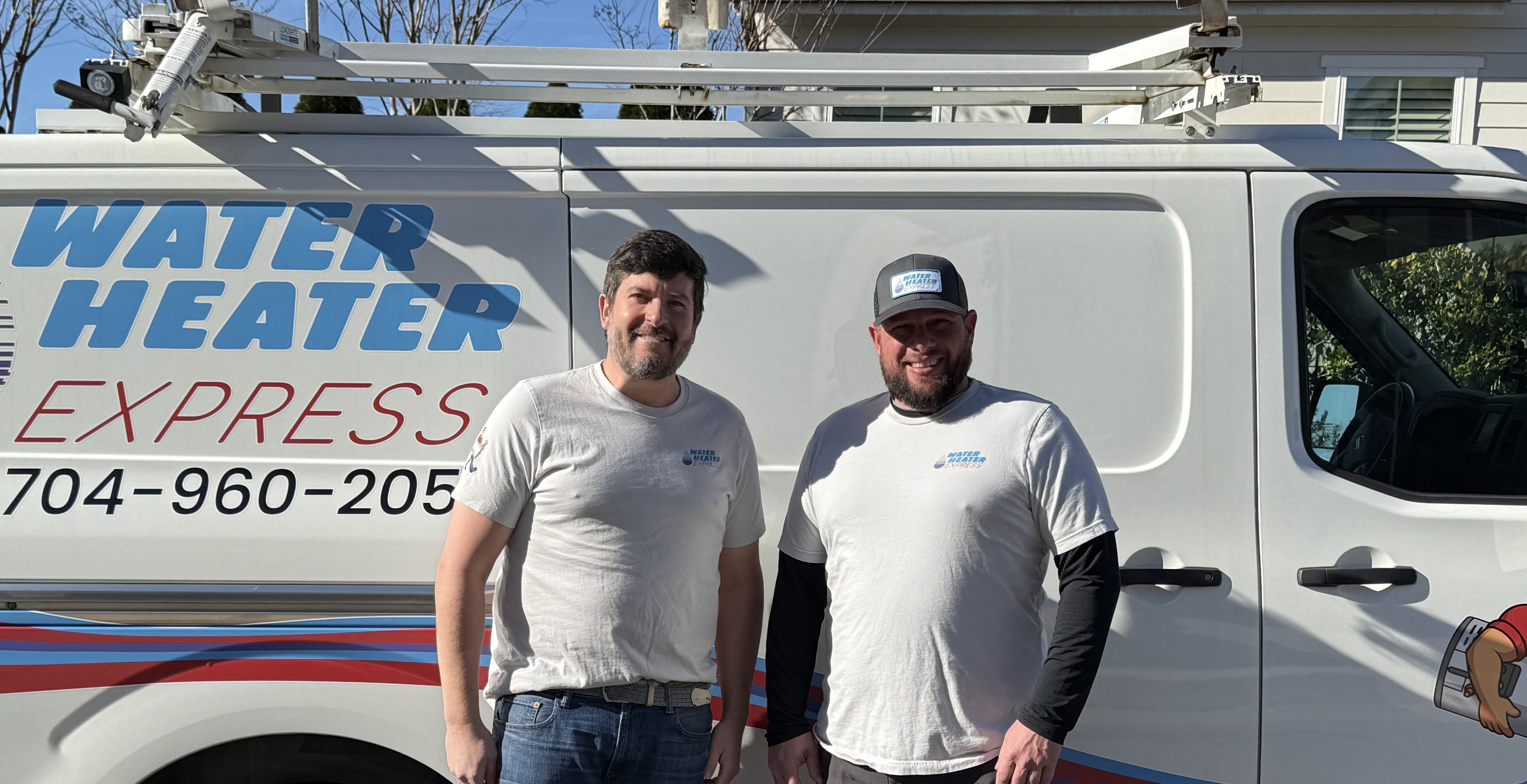 Josh and Matt, owners of Water Heater Express, in front of company van in Charlotte NC